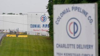 The entrance of Colonial Pipeline Company is shown Wednesday, May 12, 2021, in Charlotte, N.C. Several gas stations in the Southeast reported running out of fuel, primarily because of what analysts say is unwarranted panic-buying among drivers, as the shutdown of a major pipeline by hackers entered its fifth day.