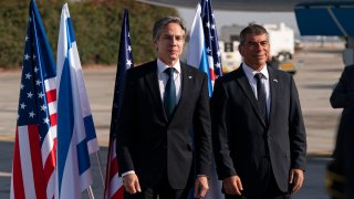 Secretary of State Antony Blinken, left, stands with Israeli Foreign Minister Gabi Ashkenazi, upon arrival at Tel Aviv Ben Gurion Airport, Tuesday, May 25, 2021, in Tel Aviv, Israel. Blinken has arrived in Israel at the start of a Middle East tour aimed at shoring up the Gaza cease-fire.