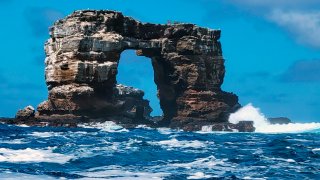 This photo distributed by Galapagos National Park shows Darwin's Arch off the Galapagos Islands, Ecuador, Sunday, May 16, 2021. Ecuador’s Environment Ministry reported the collapse of the top of the arch on its Facebook page on Monday, May 17, and blame natural erosion of the stone.