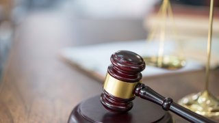 Justice Scales and books and wooden gavel