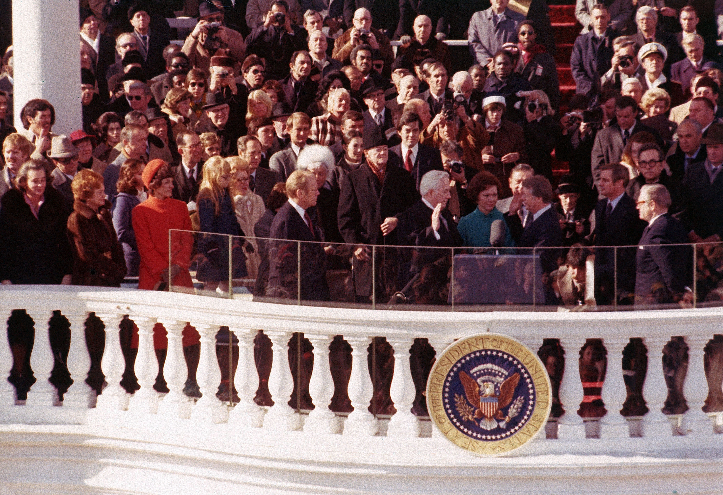 Jimmy Carter takes the oath of office as the nation’s 39th president during inauguration ceremonies in Washington, D.C., on Jan. 20, 1977. Carter’s wife, Rosalynn, holds the Bible used in the first inauguration by George Washington as U.S. Chief Justice Warren Burger administers the oath.  Looking on at left are, Happy Rockefeller, Betty Ford, Joan Mondale, Amy Carter and outgoing President Gerald Ford. Behind Carter is Vice President Walter Mondale. At far right is former Vice President Nelson Rockefeller.