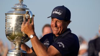 Phil Mickelson holds the Wanamaker Trophy after winning the PGA Championship golf tournament on the Ocean Course, Sunday, May 23, 2021, in Kiawah Island, South Carolina.