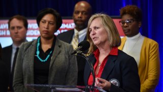 WASHINGTON, DC – MARCH 13: Dr. Jennifer Smith, Director of the Department of Forensic Sciences (DFS), joins DC mayor Muriel Bowser and other District officials in addressing the media concerning how the city will respond to the current novel coronavirus pandemic at the University of the District of Columbia Community College in Washington, DC, on Friday, March 13, 2020. (Photo by Jahi Chikwendiu/The Washington Post via Getty Images)