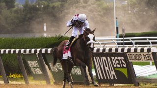 Elmont, N.Y.: Manuel Franco riding Tiz the Law wins first place during the Belmont Stakes at Belmont Park in Elmont, New York on June 20, 2020.