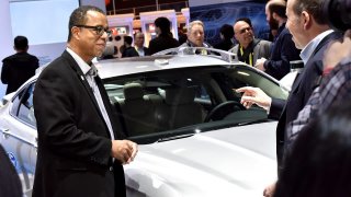 Ford CTO Ken Washington (left) is leaving the automaker for Amazon in July.