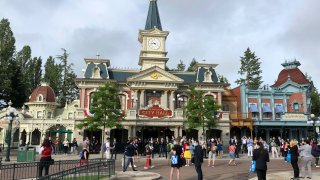 Visitors wait to enter Disneyland Paris