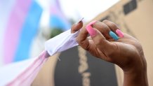A marcher has their fingernails painted in the pink and blue transgender community colors at the Los Angeles Gay Pride Resist March, June 11, 2017 in Hollywood, California. (Photo credit should read ROBYN BECK/AFP via Getty Images)