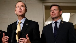 FILE - In this May 28, 2019 file photo, Rep. Adam Schiff, D-Calif., left, and Rep. Eric Swalwell, D-Calif., speak with members of the media on Capitol Hill in Washington.