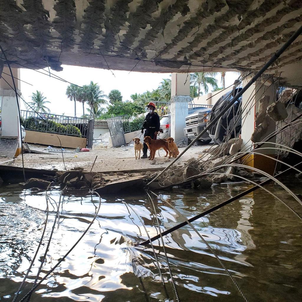 A photo shows flooding on the ground floor of the Champlain Towers after a portion of the 12-story condominium collapsed overnight, June 24, 2021, in Miami, Fla.