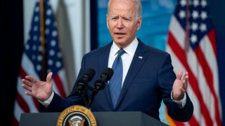 U.S. President Joe Biden speaks at a podium