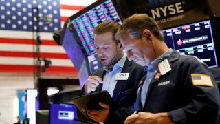 Traders work on the floor of the New York Stock Exchange (NYSE) in New York City, U.S., July 12, 2021.