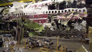 The wreckage of TWA Flight 800 sits in a hanger in Calverton, N.Y., Monday, July 16, 2001 as the fifth anniversary approaches on Tuesday. The plane, which crashed off the coast of Long Island, N.Y., on July 17, 1996, killing 230 people, is scheduled to be dismantled and moved to a George Washington University crash reconstruction training facility in Virginia. (AP Photo/ Ed Betz)