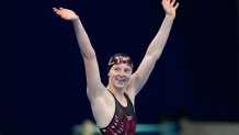 Lydia Jacoby, of the United States, celebrates after winning the final of the women's 100-meter breaststroke at the 2020 Summer Olympics, Tuesday, July 27, 2021, in Tokyo, Japan.