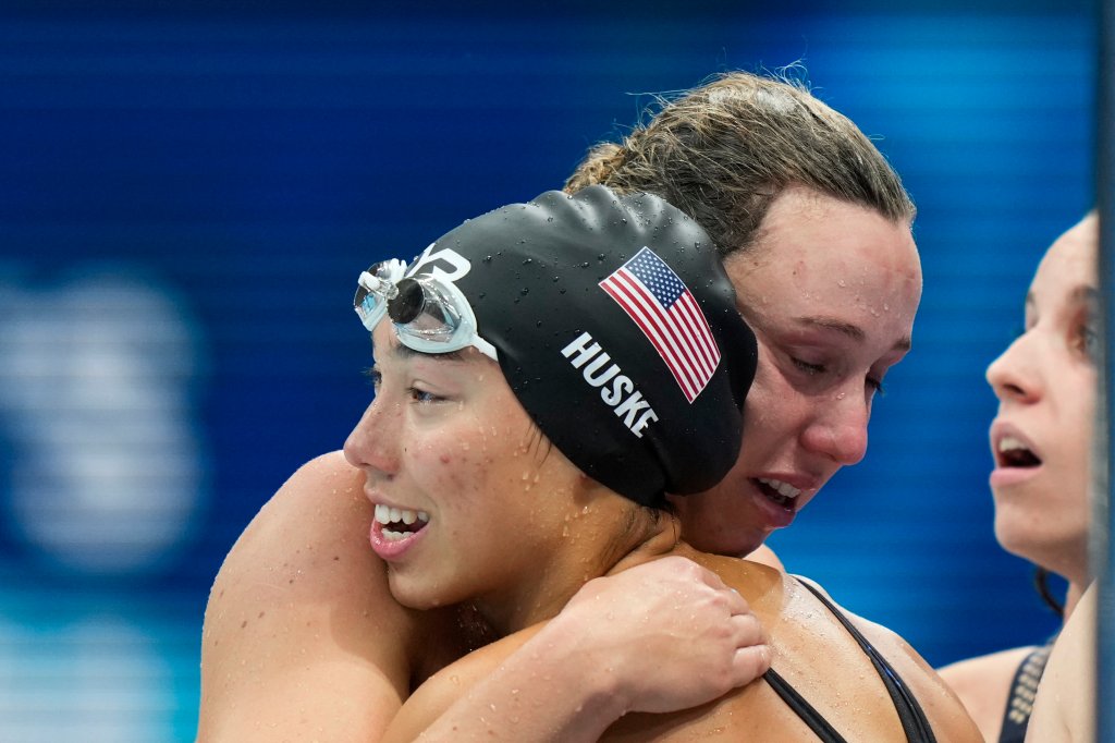 Torri Huske, of United States, embraces teammates after winning the silver medal in the women's 4x100-meter medley relay final at the 2020 Summer Olympics, Sunday, Aug. 1, 2021, in Tokyo, Japan.