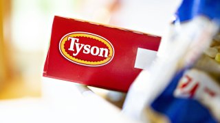 The Tyson Foods Inc. logo is seen on a box arranged for a photograph in Tiskilwa, Illinois, U.S., on Monday, Aug. 6, 2018. The largest U.S. meat company posted better-than-expected fiscal third-quarter earnings as beef demand rose and cattle costs fell, Tyson said Monday in a statement.