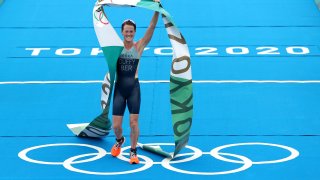 Flora Duffy of Team Bermuda celebrates winning the gold medal during the Women's Individual Triathlon