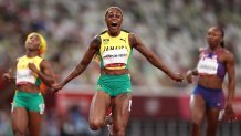 Elaine Thompson-Herah of Team Jamaica celebrates after winning the gold medal in the Women's 100m Final on day eight of the Tokyo 2020 Olympic Games at Olympic Stadium on July 31, 2021, in Tokyo, Japan.