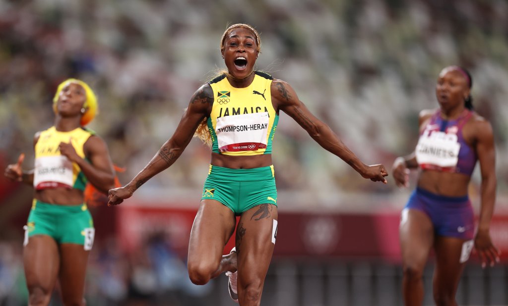 Elaine Thompson-Herah of Team Jamaica celebrates after winning the gold medal in the Women's 100m Final on day eight of the Tokyo 2020 Olympic Games at Olympic Stadium on July 31, 2021, in Tokyo, Japan.