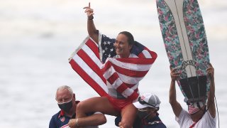 Carissa Moore of Team United States celebrates winning the Gold Medal after her final match against Bianca Buitendag of Team South Africa on day four of the Tokyo 2020 Olympic Games 