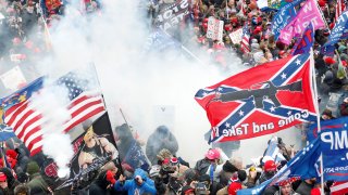 Tear gas is released into a crowd of protesters during clashes with Capitol police at a rally to contest the certification of the 2020 U.S. presidential election results by the U.S. Congress, at the U.S. Capitol Building in Washington, January 6, 2021.