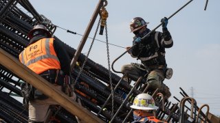 Construction workers install steel rebar on the Sixth Street Viaduct replacement project in Los Angeles, California, on Tuesday, April 6, 2021.