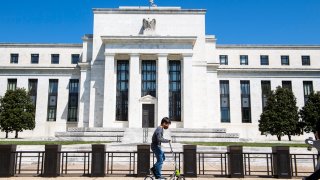 A child passes by the Marriner S. Eccles Federal Reserve Board Building on Constitution Avenue, NW, on Monday, April 26, 2021.