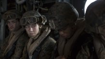 U.S. Marine Corps Corporal Nicole Gee (left middle), a maintenance technician with 24th Marine Expeditionary Unit (MEU), awaits the launch of an MV-22B Osprey during an en route care exercise aboard the Wasp-class amphibious assault ship USS Iwo Jima (LHD 7), April 5, 2021.