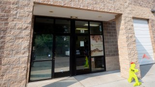 The entrance of Scales and Tails Utah is shown Monday, Aug. 16, 2021, in West Valley City, Utah. A Utah reptile center employee is recovering after an alligator yanked her into its enclosure during a presentation, and a visitor leapt in after her and freed her from its jaws.