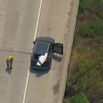 It appears a piece of the aircraft landed on a car on the freeway,