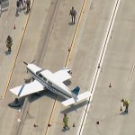Aerial image shows first responders at the scene of the plane landing.