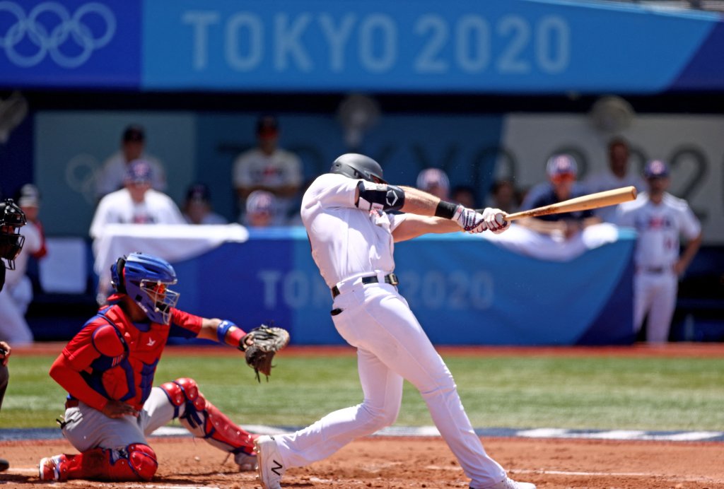 USA's Triston Casas (R) hits a two run home run during the first inning of the Tokyo 2020 Olympic Games baseball round 2 repechage game between Dominican Republic and USA at Yokohama Baseball Stadium in Yokohama, Japan, on Aug. 4, 2021.