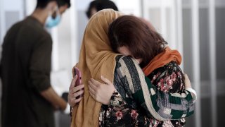 Afghan refugees arrive at Dulles International Airport