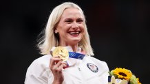 Gold medalist Katie Nageotte of Team USA holds her gold medal on the podium during the medal ceremony for the Women's Pole Vault on day fourteen of the Tokyo Olympic Games at Olympic Stadium on Aug. 6, 2021, in Tokyo, Japan.