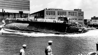 FILE - In this July 9, 1960 file photo, the 278-foot nuclear-powered attack submarine USS Thresher is launched at the Portsmouth Navy Yard in Kittery, Maine.