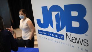Signage at a Job News USA career fair in Louisville, Kentucky, June 23, 2021.