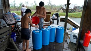 barrels of rainwater they collected from Tropical Storm Nicholas