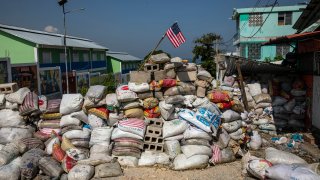 A U.S. national flag tops a barricade delimiting territorial gang control in the Bel Air neighborhood of Port-au-Prince, Haiti