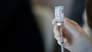 FILE - In this March 29, 2021 file photo, a worker readies syringes with the Moderna COVID-19 vaccine in Metairie, La. The Centers for Disease Control and Prevention is urging all pregnant women to get vaccinated against COVID-19, Wednesday, Aug. 11. The advice comes as hospitals in hot spots around the U.S. see disturbing numbers of unvaccinated mothers-to-be seriously ill with the virus.