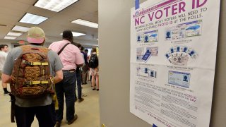 RALEIGH, NC - MARCH 15: North Carolina State University students wait in line to vote in the primaries at Pullen Community Center on March 15, 2016 in Raleigh, North Carolina. The North Carolina primaries is the state's first use of the voter ID law, which excludes student ID cards. Wake County was among the highest use of provisional ballots, where those voters had home addresses on or near campuses. The Board of Elections will review voter's reasonable impediment form submitted with their provisional ballots to determine if their vote counts. The state's voter ID law is still being argued in federal court.