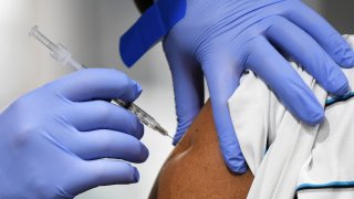 Close-up of a person receiving a shot
