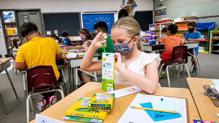 A student works on her name tag in a second and third grade combo class during the first day of school at Laguna Niguel Elementary School in Laguna Niguel, CA on Tuesday, August 17, 2021.