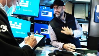 Traders work on the floor of the New York Stock Exchange (NYSE) on October 15, 2021 in New York City.