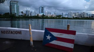 A wooden Puerto Rican flag is displayed on the dock of the Condado lagoon