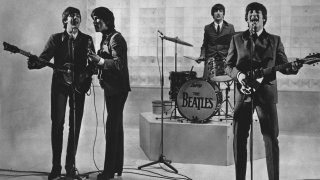The Beatles are seen performing, date unknown