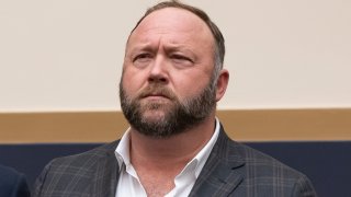 FILE - This Tuesday, Dec. 11, 2018 file photo shows radio show host and conspiracy theorist Alex Jones at Capitol Hill in Washington. On Thursday, April 9, 2020, the U.S. Food and Drug Administration sent a warning letter ordering Jones to stop falsely claiming that toothpaste, mouth wash and other products sponsored by his show can help prevent COVID-19.