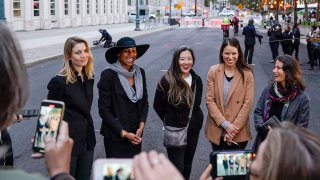 In this Oct. 27. 2020 file photo, Nicki Clyne, left, Michelle Hatchette, second from left, Linda Chung, center, and Dr. Danielle Roberts, right, speak outside Brooklyn federal court following the sentencing hearing for self-improvement guru Keith Raniere, in New York