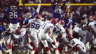 Buffalo Bills kicker Scott Norwood (11) walks off the field after missing a  47-yard field goal on the last play of the game, clinching a 20-19 victory  for the New York Giants