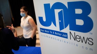 Signage at a Job News USA career fair in Louisville, Kentucky