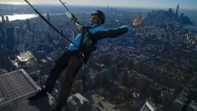 Climb guide Jason Johnson leans off the edge at the top of City Climb, a new attraction at 30 Hudson Yards in New York, Wednesday, Nov. 3, 2021. City Climb starts at The Edge observation deck, from where you climb an external staircase to reach the top of the building, nearly 1,300 feet above the ground. At the top, a safety harness allows the climber to lean out over New York City and enjoy a panoramic view in the fresh air, unimpeded by glass. (AP Photo/Seth Wenig)