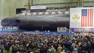 Photo shows the christening of the Navy's nuclear-powered attack submarine USS Vermont at General Dynamics Electric Boat in Groton, Conn